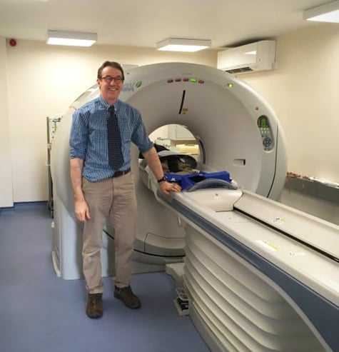 Dr. Duncan Hole and the CT scanner recently installed at Swayne and Partners